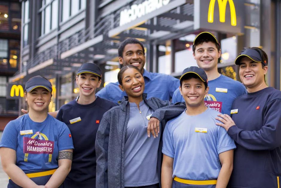 McDonald’s crew members outside a restaurant.